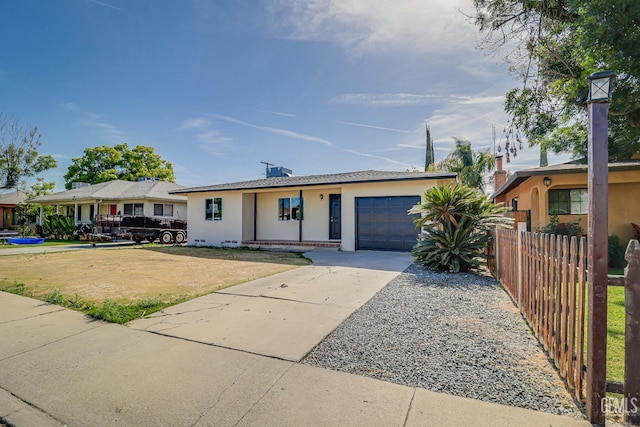 1201 Quincy St, Delano, CA 93215 - single story home with an attached garage, stucco siding, and concrete driveway