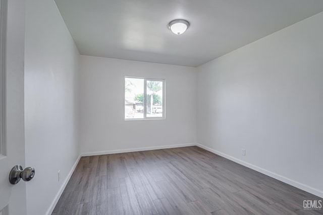 1201 Quincy St, Delano, CA 93215 - unfurnished room featuring wood finished floors and baseboards
