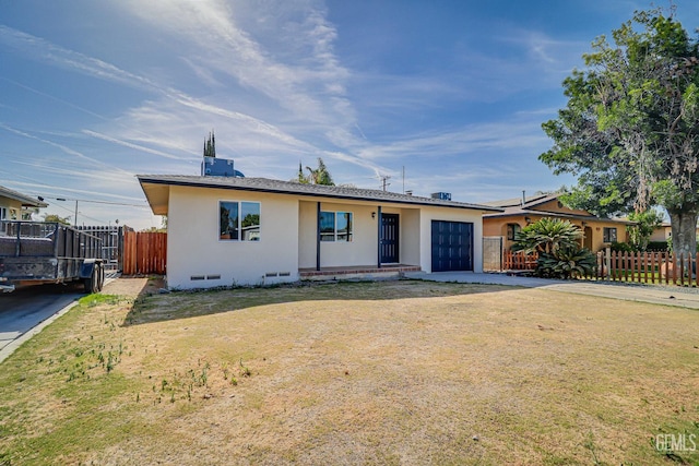 1201 Quincy St, Delano, CA 93215 - view of front of house featuring an attached garage, stucco siding, crawl space, and driveway