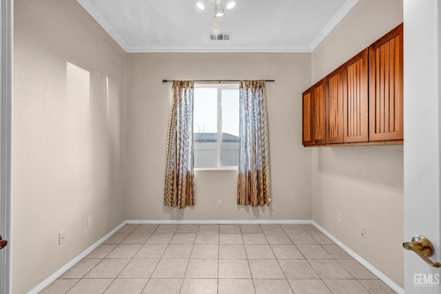 unfurnished room with light tile patterned floors, ornamental molding, baseboards, and visible vents