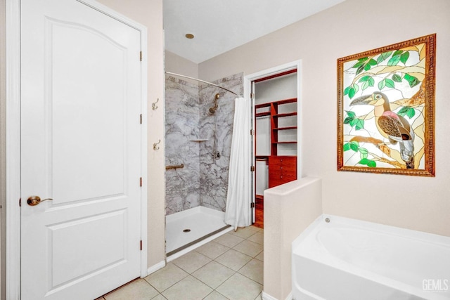 full bathroom with a garden tub, tile patterned flooring, and a shower stall