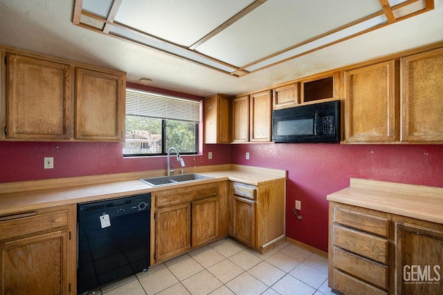 4120 Willow Trl, Frazier Park, CA 93225 - kitchen with black appliances, brown cabinetry, light countertops, and light tile patterned flooring