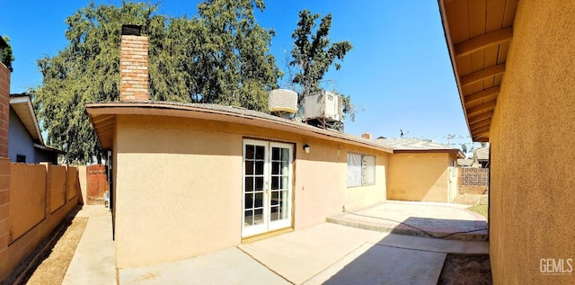 back of property with a patio