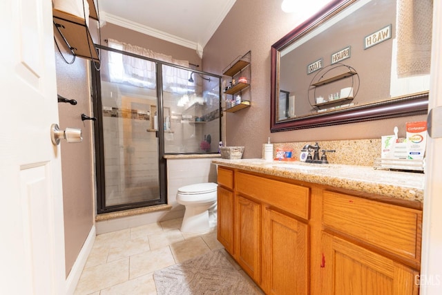 bathroom featuring toilet, vanity, tile patterned floors, crown molding, and a shower with shower door