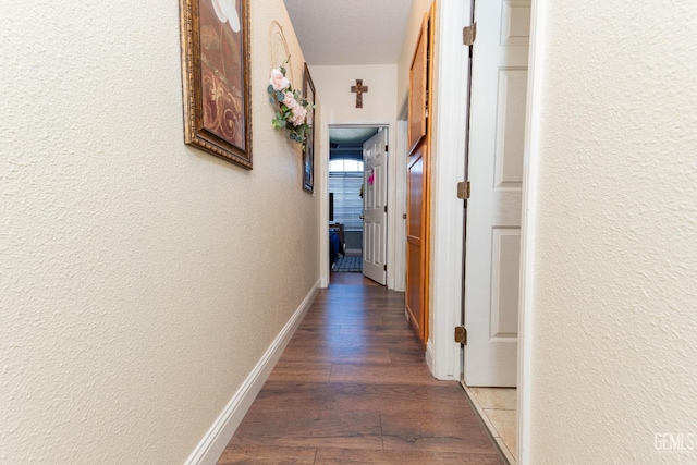 hall with dark hardwood / wood-style floors