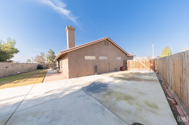 back of property with a patio area