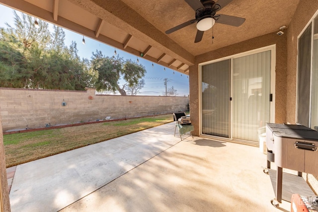 view of patio featuring ceiling fan