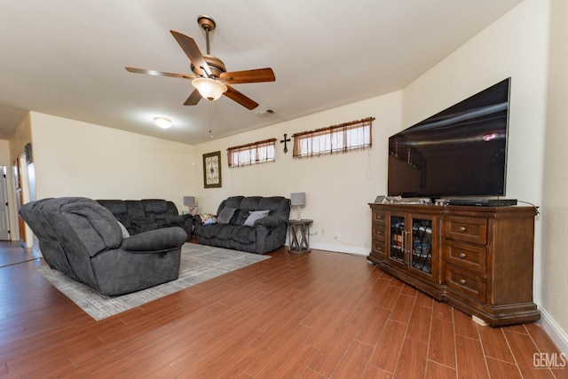 living room with ceiling fan and hardwood / wood-style flooring