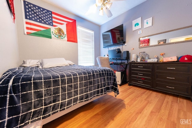 bedroom featuring ceiling fan and light hardwood / wood-style floors