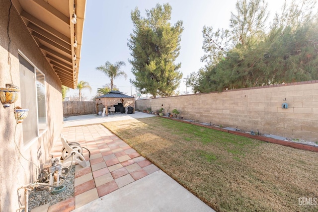 view of yard with a gazebo and a patio