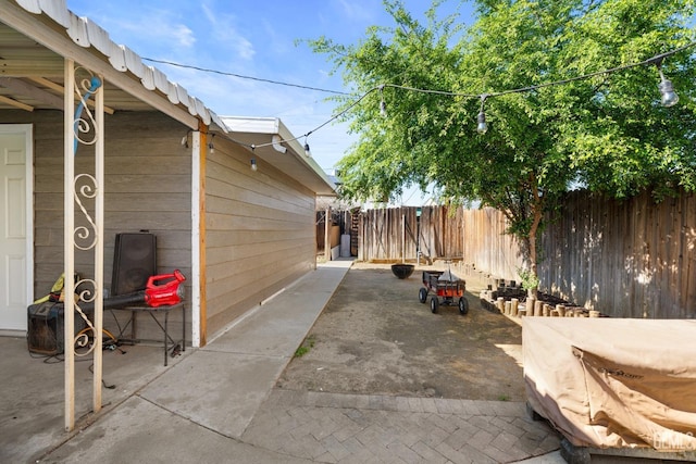 view of patio / terrace featuring fence