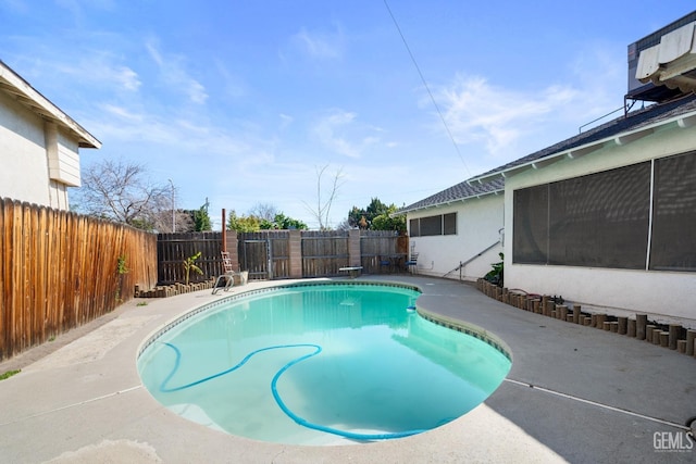 view of swimming pool featuring a fenced backyard and a fenced in pool