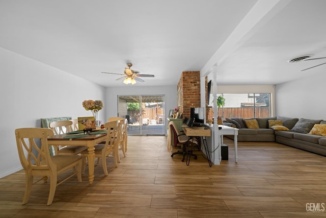 dining area with wood finish floors, plenty of natural light, and a ceiling fan