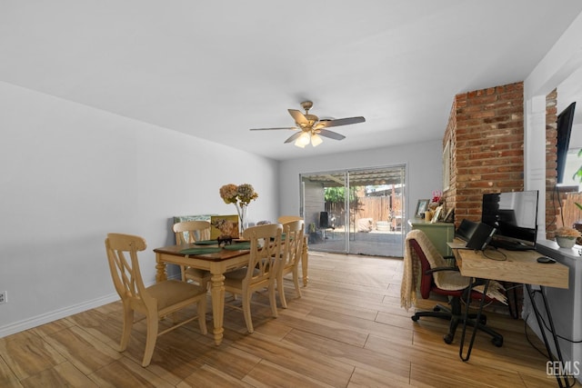 dining space featuring ceiling fan, light wood finished floors, and baseboards