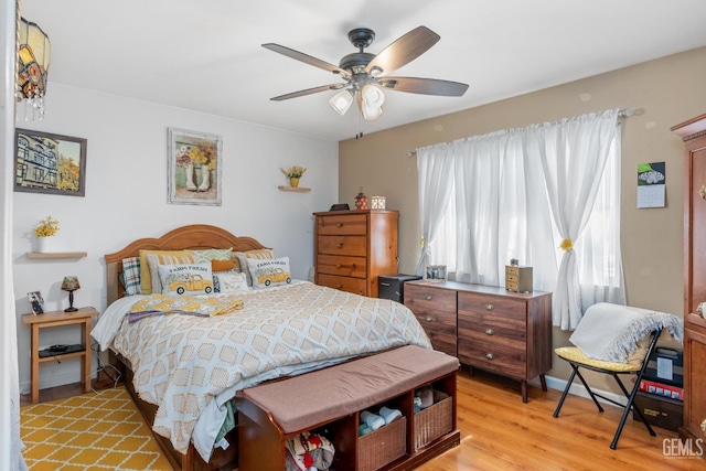 bedroom featuring ceiling fan and light wood-type flooring