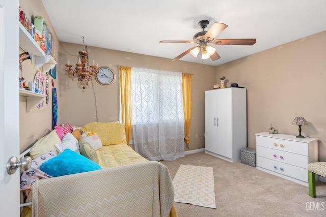 carpeted bedroom with ceiling fan