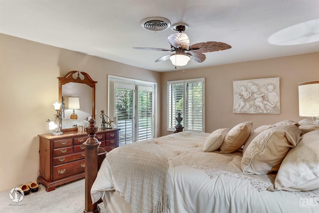bedroom featuring access to outside, ceiling fan, visible vents, and light carpet