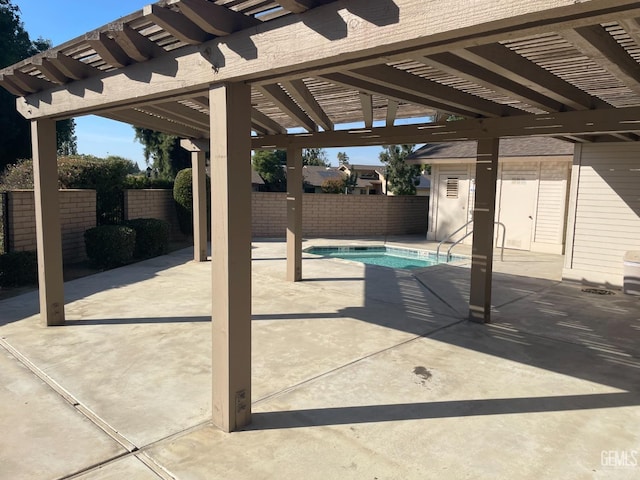view of pool with a fenced backyard, a swimming pool, a pergola, and a patio area