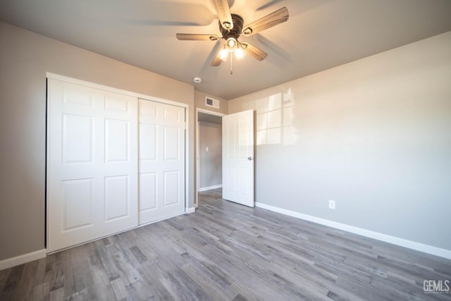 631 Union St, Delano, CA 93215 - unfurnished bedroom with baseboards, wood finished floors, a closet, and ceiling fan