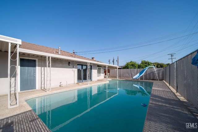 631 Union St, Delano, CA 93215 - view of swimming pool featuring a water slide and a fenced backyard