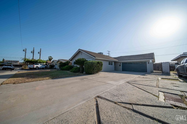 631 Union St, Delano, CA 93215 - single story home with an attached garage, driveway, and fence