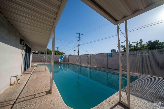 631 Union St, Delano, CA 93215 - view of pool featuring a fenced backyard and a water slide