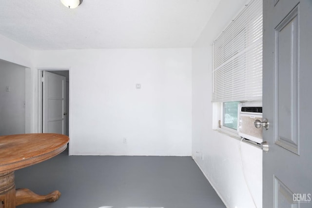 unfurnished dining area featuring finished concrete flooring