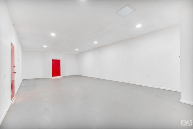 empty room featuring finished concrete flooring and recessed lighting