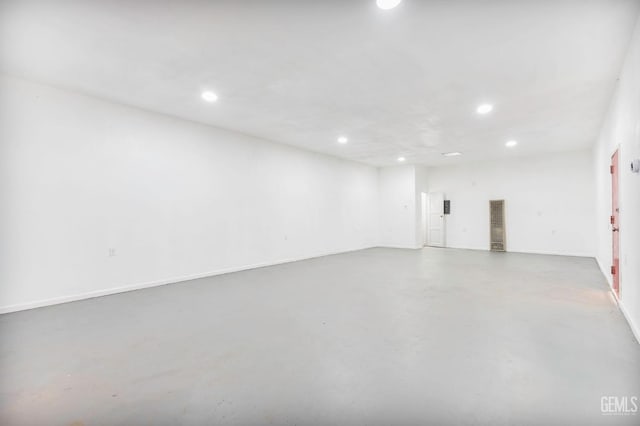 interior space featuring baseboards and recessed lighting