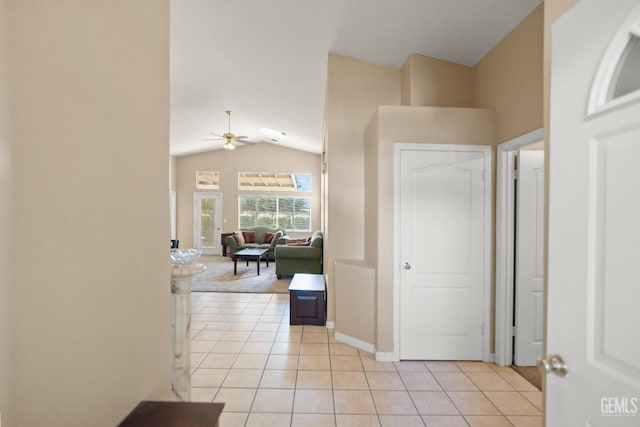 10116 Bay Colony Dr, Bakersfield, CA 93312 - corridor with lofted ceiling, light tile patterned flooring, and baseboards