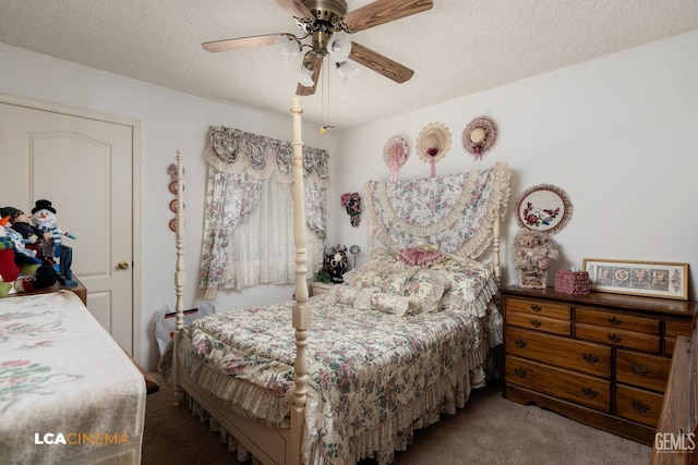 carpeted bedroom with ceiling fan and a textured ceiling