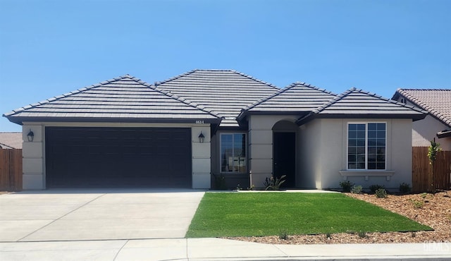 4614 Dry Port Way, Bakersfield, CA 93306 - single story home featuring an attached garage, driveway, a tile roof, and stucco siding