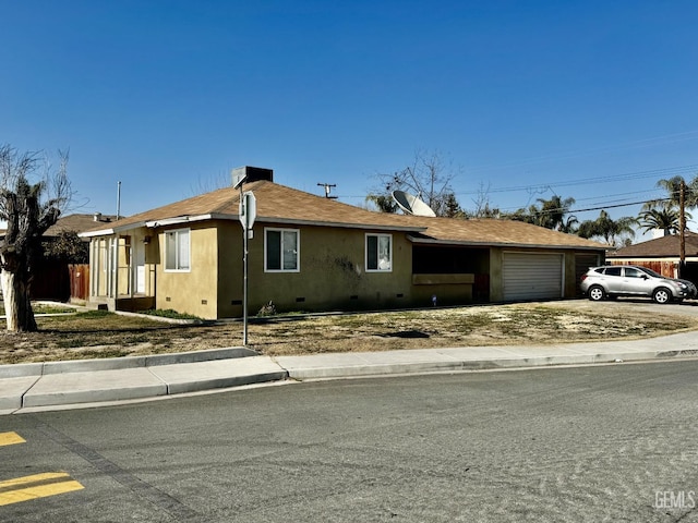 ranch-style home featuring a garage