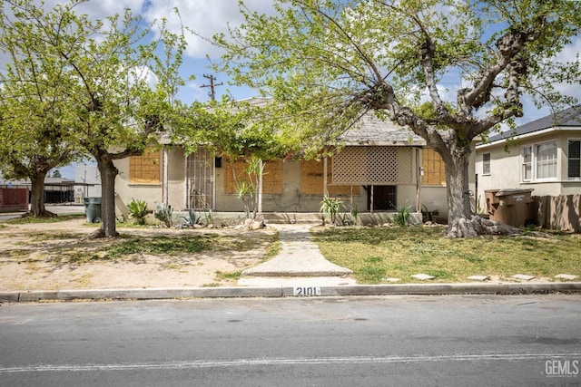 view of front of house featuring stucco siding
