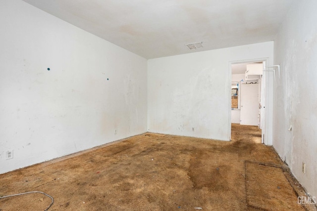 unfurnished room with unfinished concrete flooring and visible vents