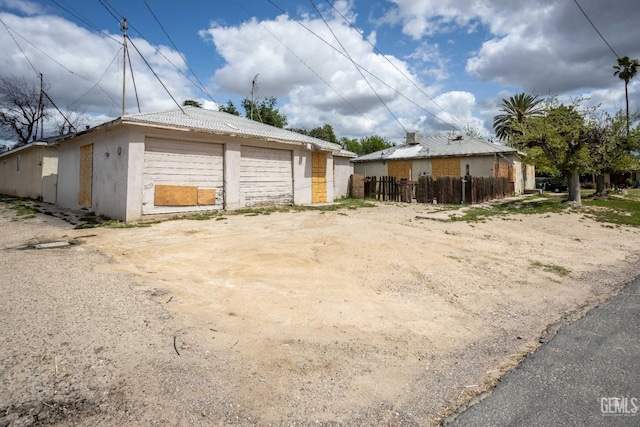 detached garage with fence