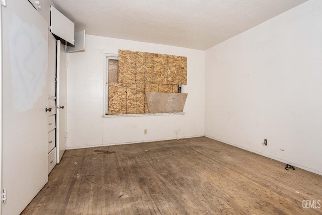 empty room with wood finished floors