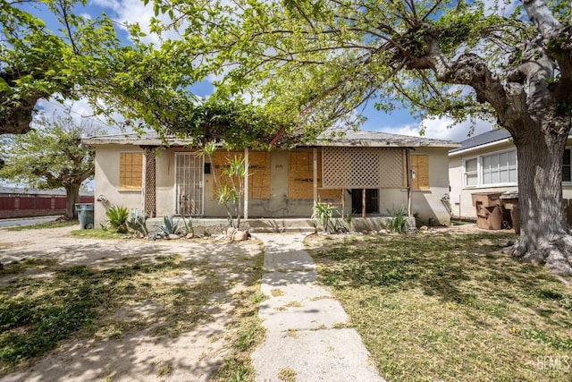 ranch-style house with stucco siding
