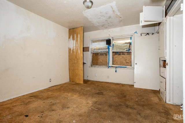 empty room with concrete flooring