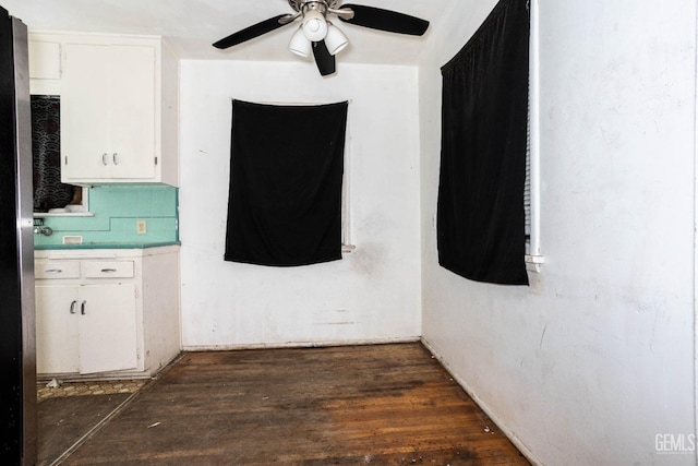 interior space featuring wood finished floors and ceiling fan