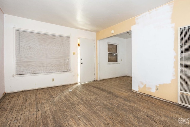 spare room with hardwood / wood-style flooring