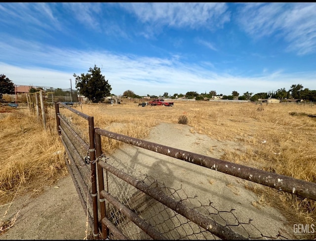 view of yard with a rural view