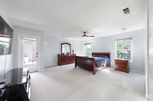 7001 Eloy Ave, Bakersfield, CA 93308 - bedroom with light carpet, a textured ceiling, baseboards, and visible vents