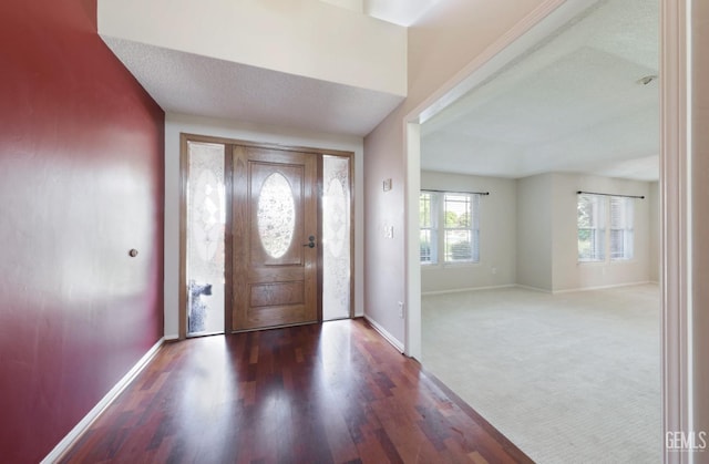 7001 Eloy Ave, Bakersfield, CA 93308 - entrance foyer with baseboards, carpet floors, and wood finished floors