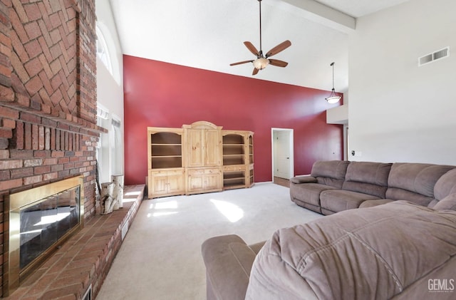 7001 Eloy Ave, Bakersfield, CA 93308 - carpeted living room with high vaulted ceiling, a ceiling fan, a fireplace, visible vents, and beamed ceiling