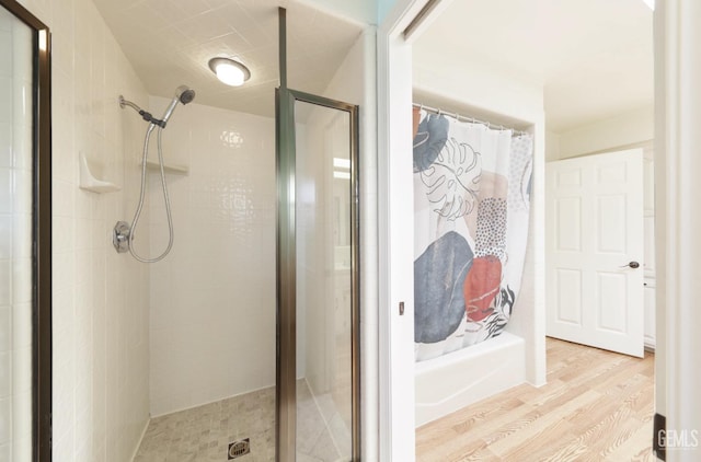7001 Eloy Ave, Bakersfield, CA 93308 - full bathroom featuring wood finished floors and a shower stall