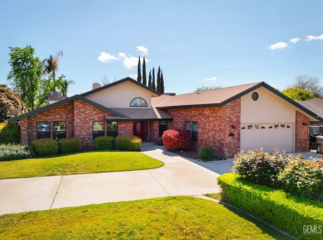 7001 Eloy Ave, Bakersfield, CA 93308 - view of front of house with an attached garage, brick siding, a front lawn, and stucco siding
