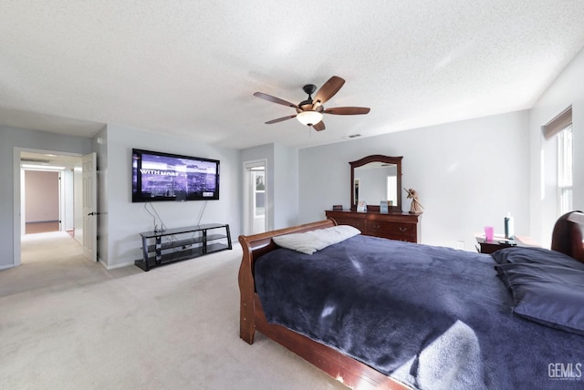 7001 Eloy Ave, Bakersfield, CA 93308 - bedroom with a ceiling fan, visible vents, light carpet, and a textured ceiling