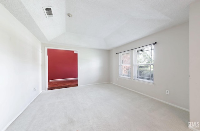 7001 Eloy Ave, Bakersfield, CA 93308 - carpeted spare room featuring a tray ceiling, baseboards, a textured ceiling, and visible vents