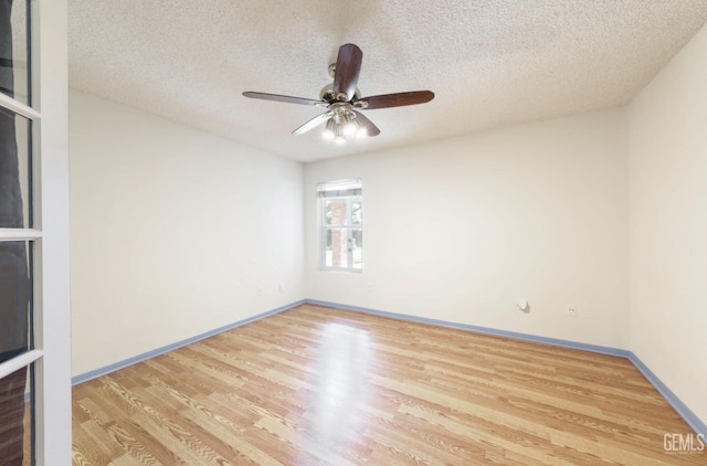 7001 Eloy Ave, Bakersfield, CA 93308 - spare room featuring baseboards, light wood-style floors, a textured ceiling, and ceiling fan